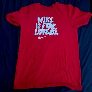 Nike shirt it is an X small and it is red and white